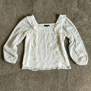 Banana Republic blouse with white polka dot pattern.